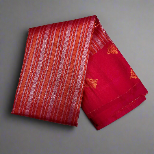 Red and orange fabric with gold patterns on a gray background